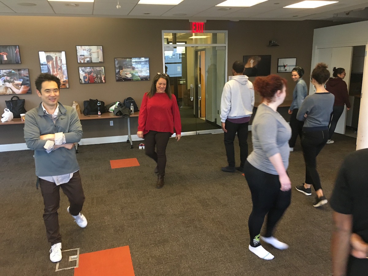 Students walking around room